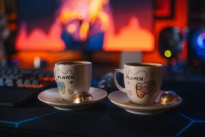 cozy gaming player one and player two mugs with video game controllers on them